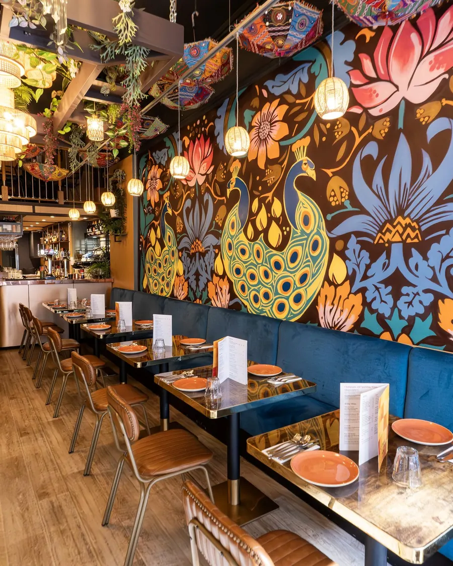 Nutmeg's dining room with a painted peacock mural